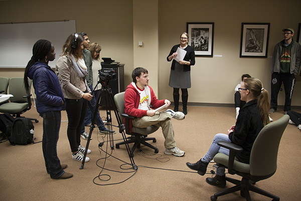 Students learn oral history filming techniques from the Norwick Center staff.