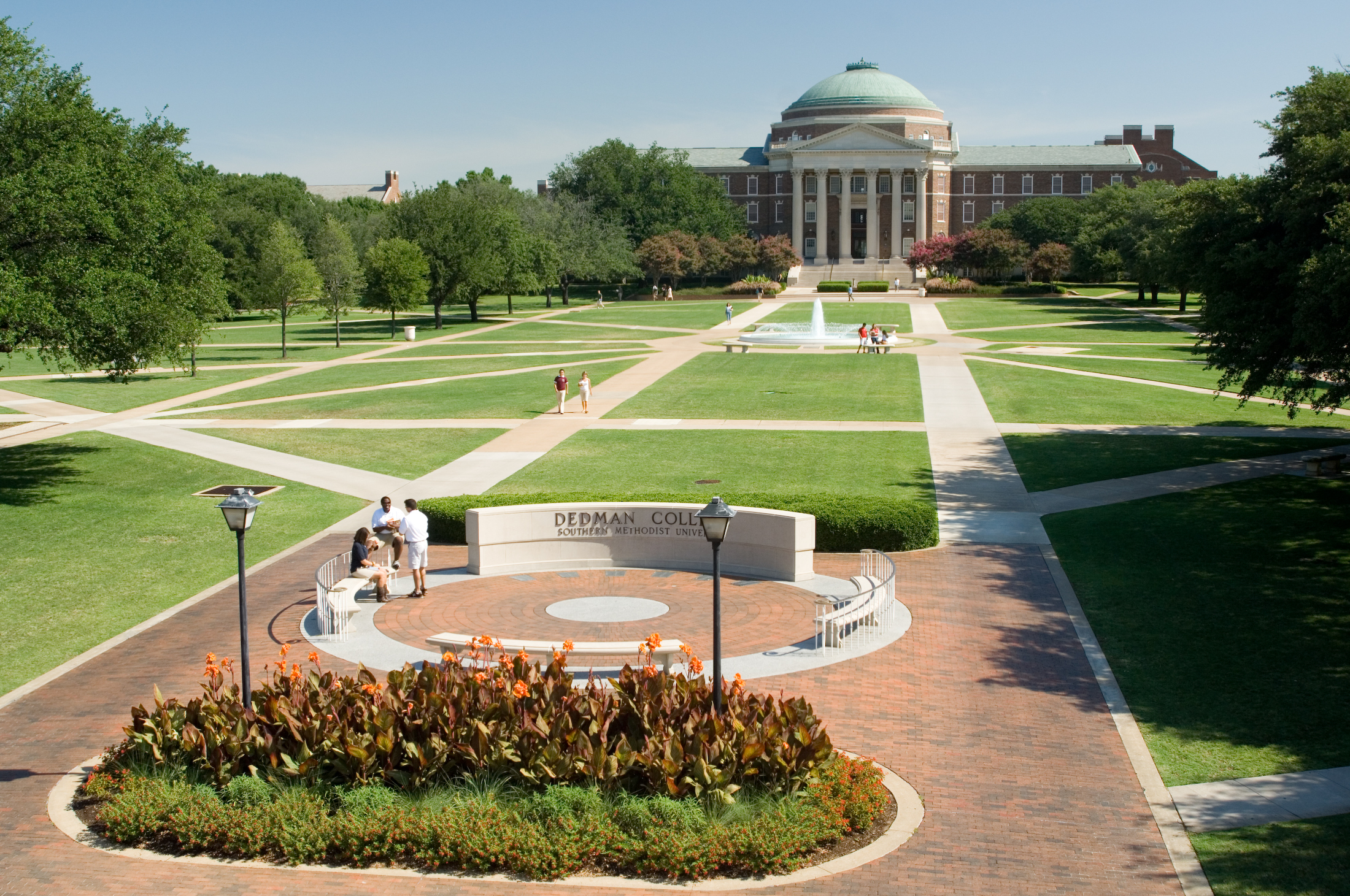 Dallas Hall, SMU's iconic building with a dome, symbolizes the university's classic Georgian style and intellectual tradition.