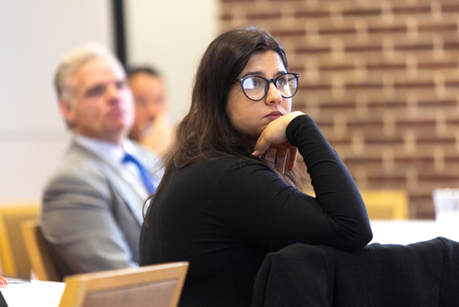 Student listening to lecture at SMU Cox
