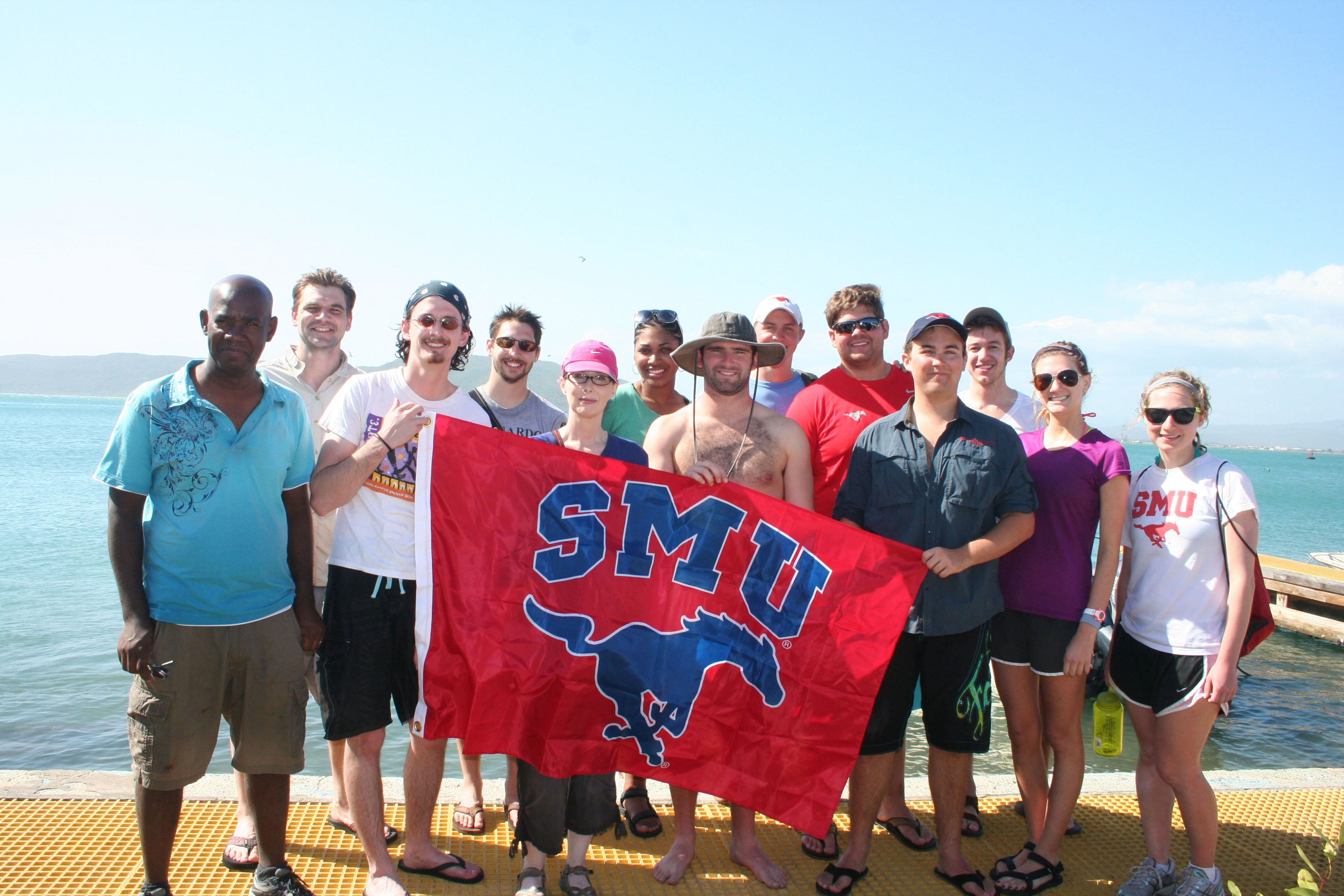 group of students with smu banner