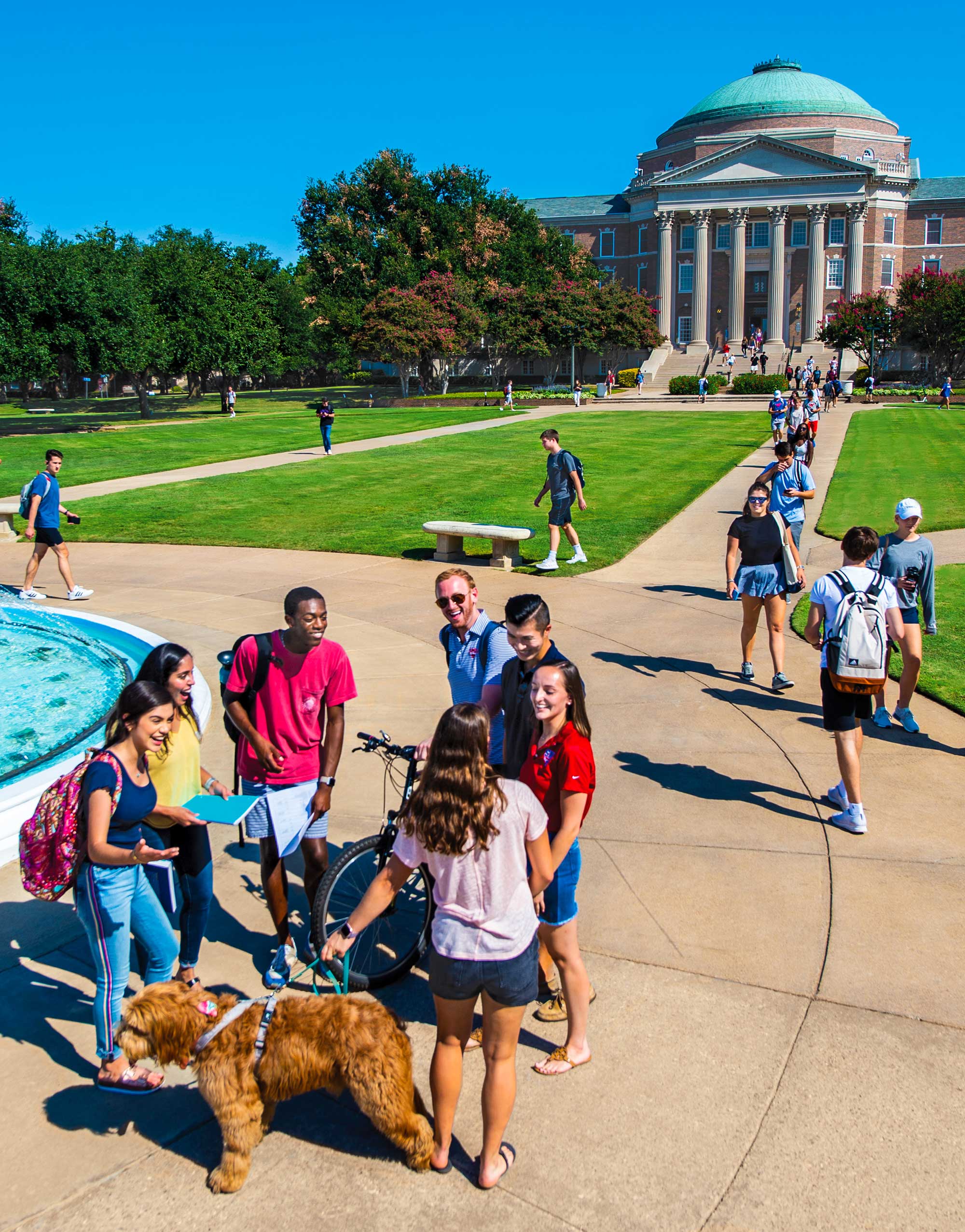 SMU students gathered near the fountain on the lawn of Dallas Hall