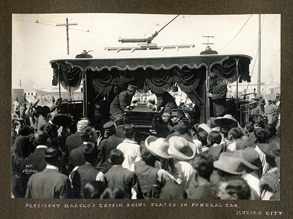 President Madero's coffin being placed in funeral car, Mexico City, 1913