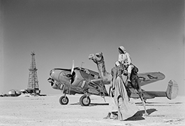 Wildcat well, Beechcraft airplane, and camel, 1946, by Robert Yarnall Richie