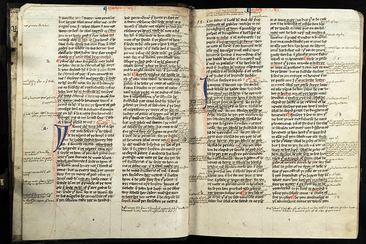 Open Wycliffite New Testament with annotations and marginal markings.
