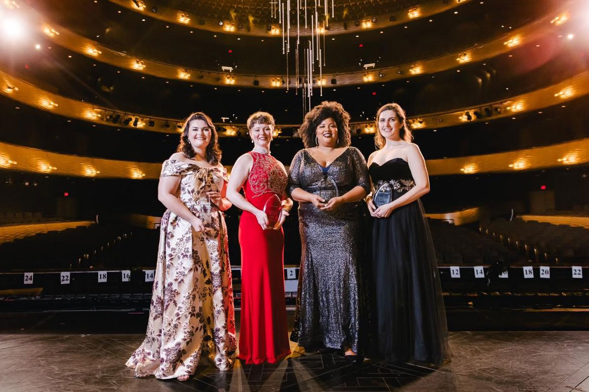 Bethany Jelinek poses on stage with fellow award winners of The Dallas Opera Competition
