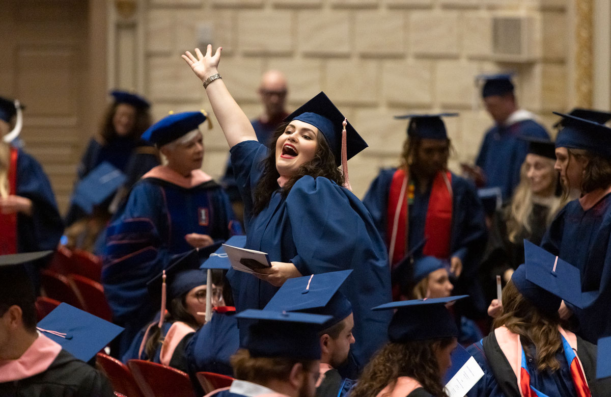 A graduate celebrates in the crowd at the 2023 Degree Recognition Ceremony.
