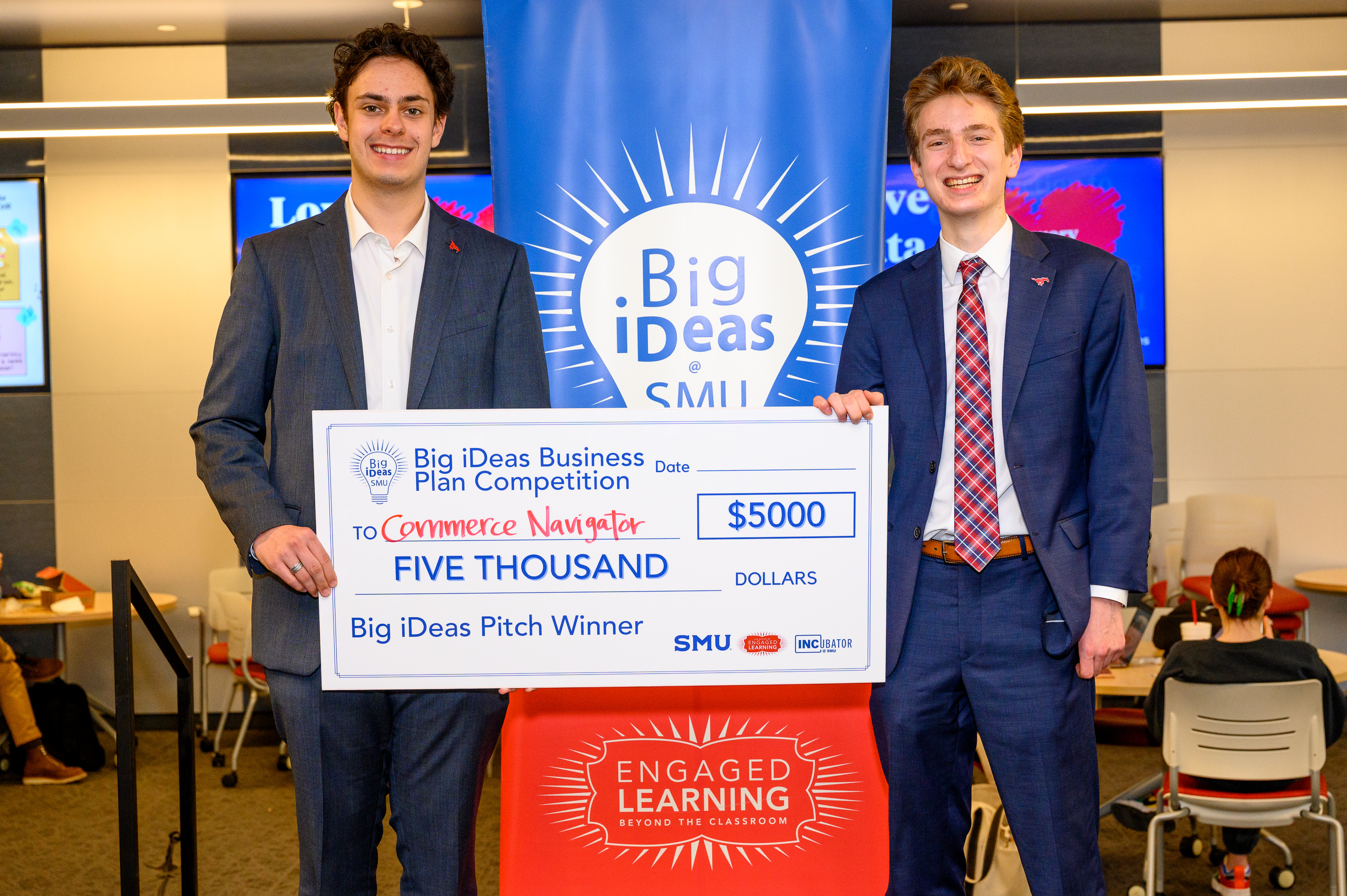 Commerce Navigator founders Michael Castle and Jude Lugo with their big check at the Big iDeas competition