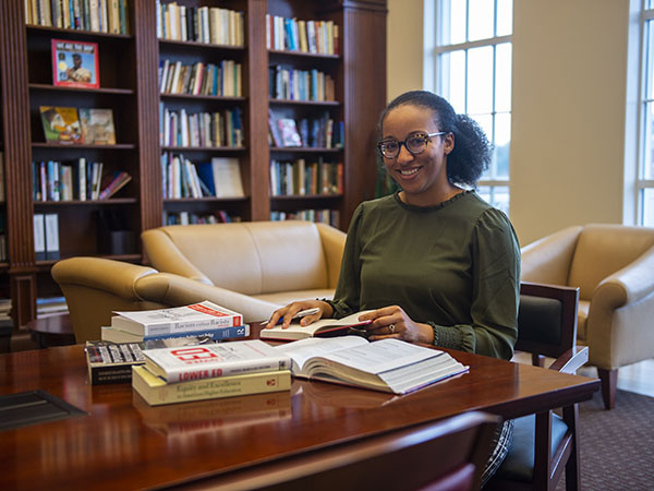 Dr. Baker working in the Simmons School Reading Room.