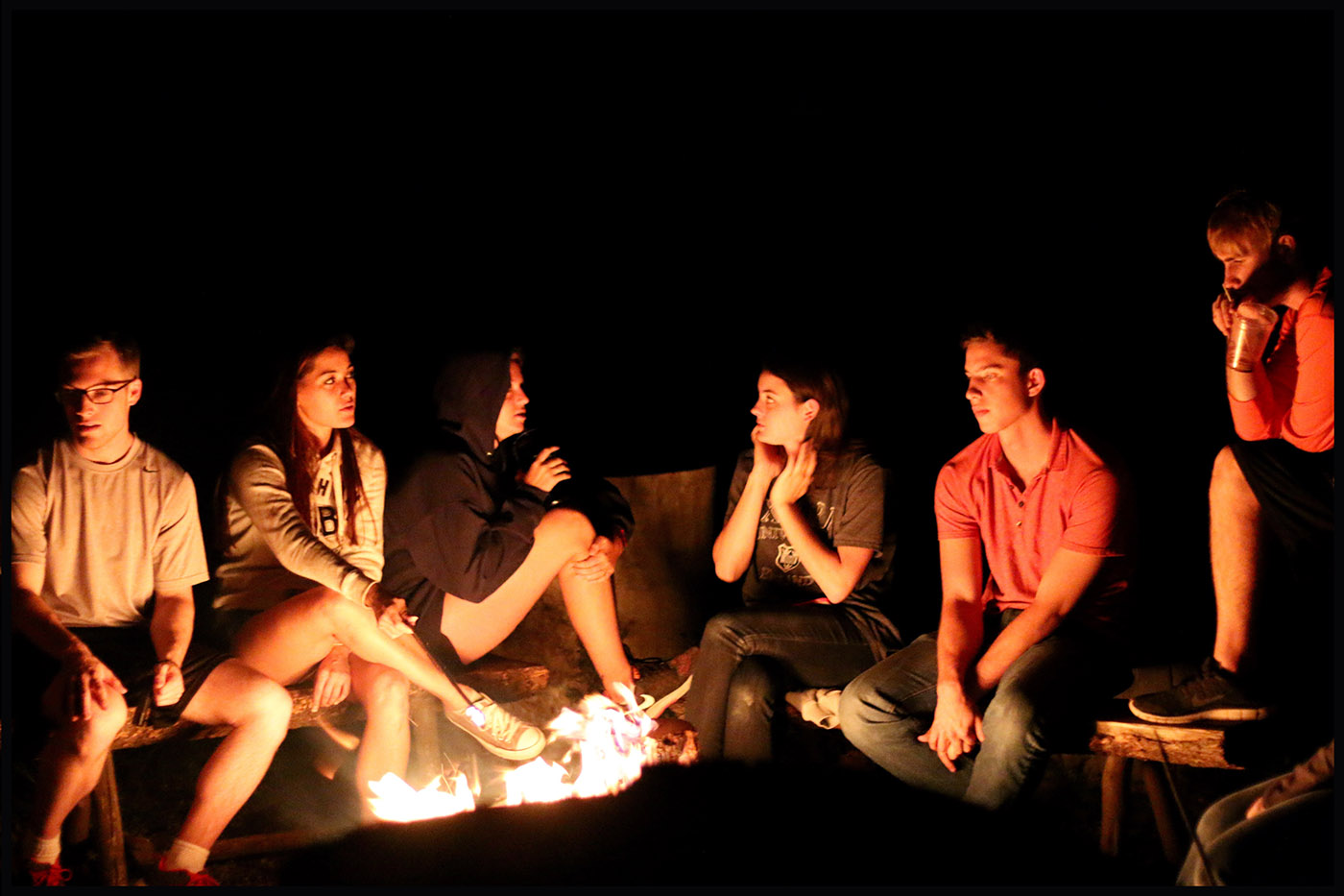 A group of SMU-in-Taos students enjoys a bonfire