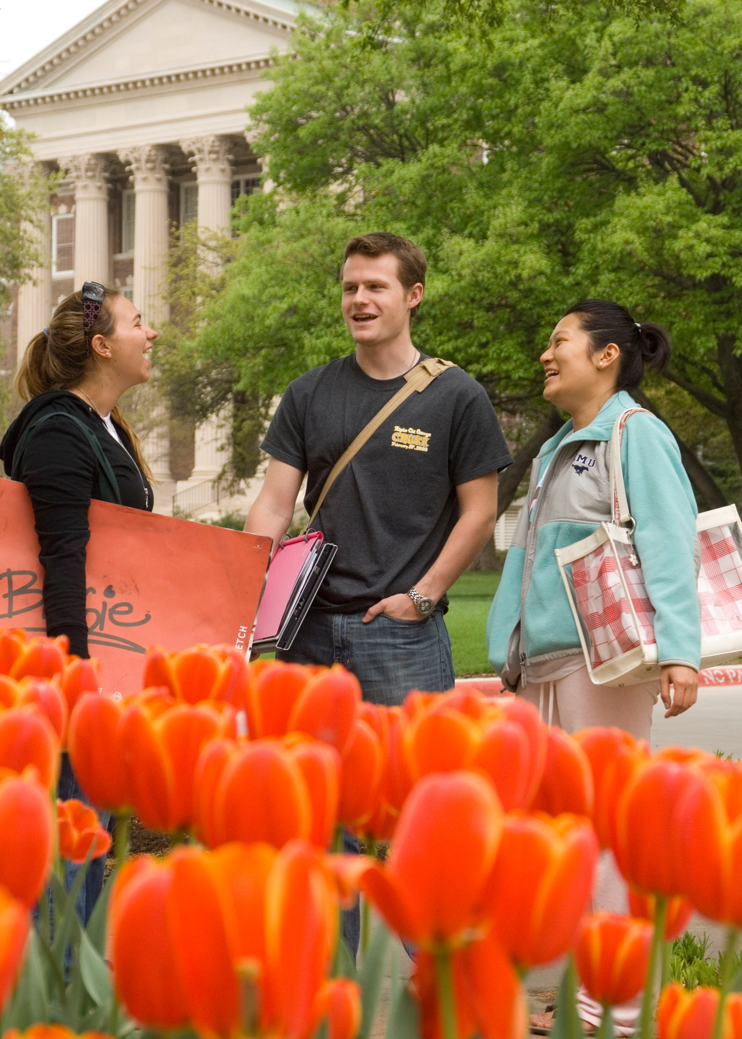 Orange Tulips and Students outside Dallas Hall