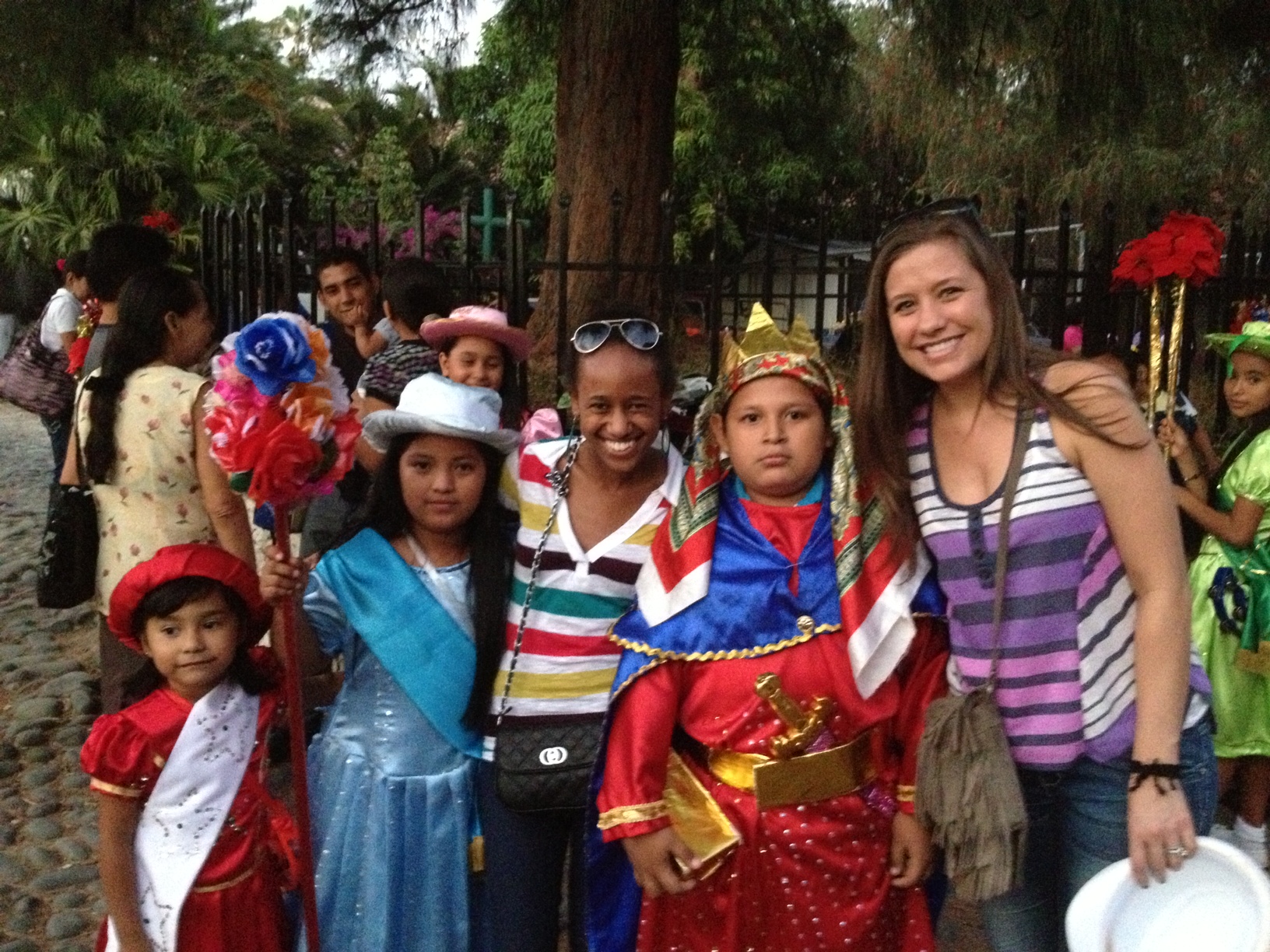 SMU students with children in indigenous costumes