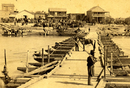 American Side. Pontoon Bridge over Rio Grande River ca. 1866, Louis de Planque (attributed) Robin Sanford Collection. View facing Levee Street, Brownsville during Federal occupation. Note African American soldier from 114th U.S. Colored troops.