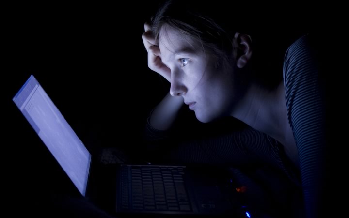 Woman looking at a computer screen