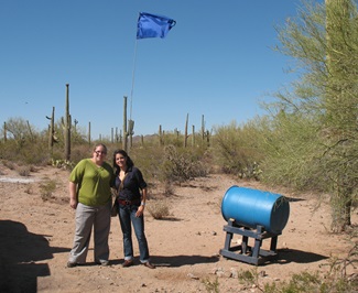 SMU Embrey Human Rights Program students Jordan Johansen, left, and Adriana Martinez stand at a water station for migrants in the Arizona desert during their Student Leadership Initiative trip in January 2011.