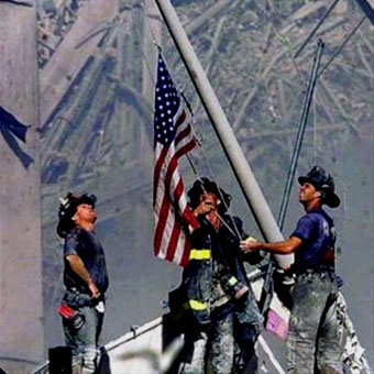 Firefighters raise American flag at Ground Zero in NYC