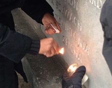 SMU student Genesis Reed lights a candle at the former Nazi extermination camp Belzec, near Lublin, Poland.