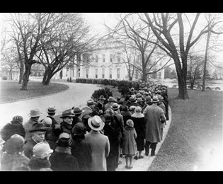 Thousands of Americans in 1927 lined up outside the White House to attend a reception hosted by President Calvin Coolidge. The tradition began with George Washington's presidency and continued through the presidency of Herbert Hoover. Photo courtesy the U.S. Library of Congress.