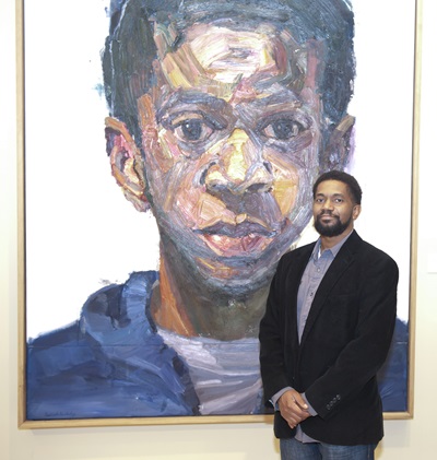 Sedrick Huckaby at the Meadows Museum with his painting Rising, Sonny, Son, (2013-16).