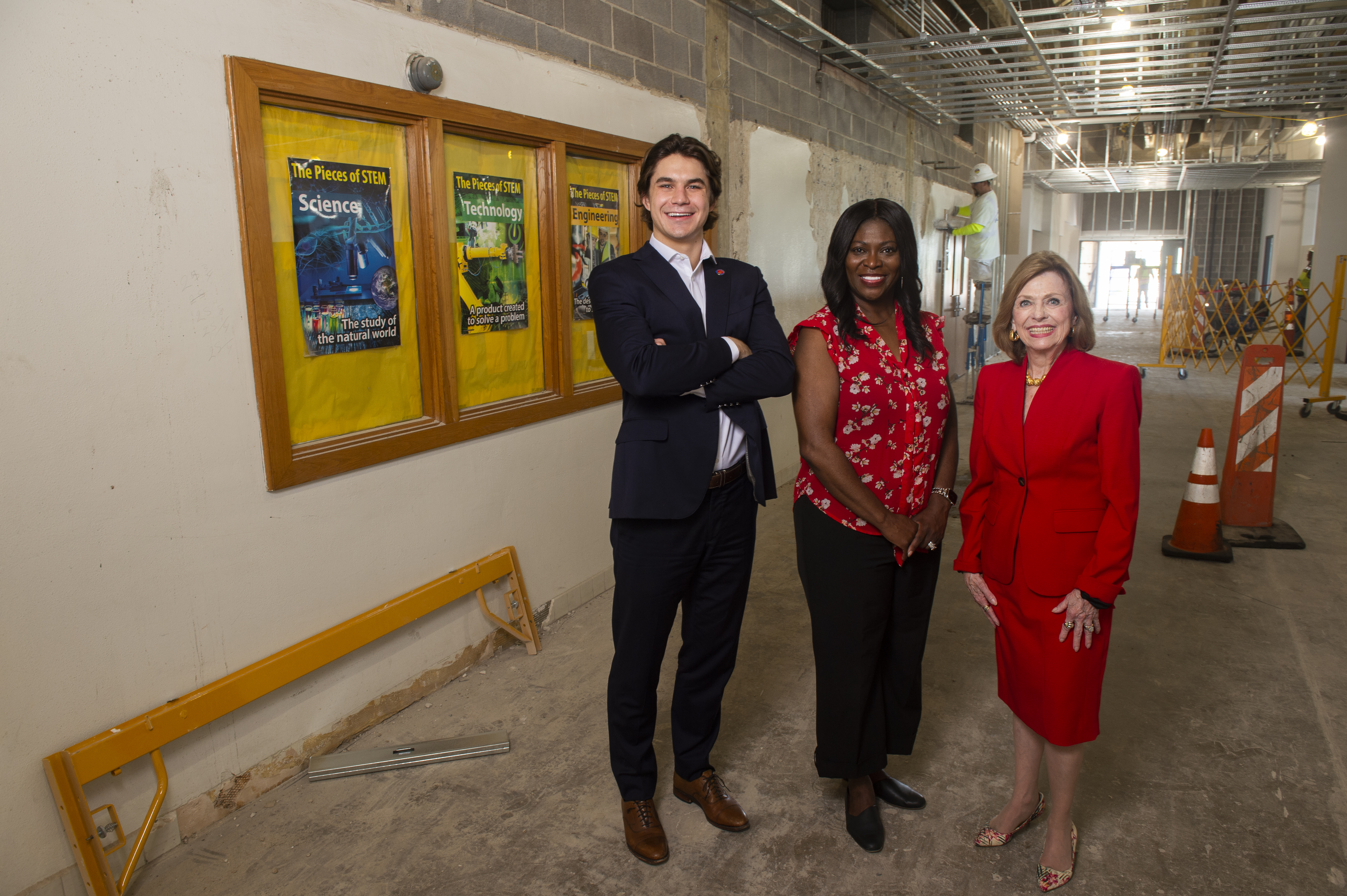 Austin Hickle, Marion Walker and Dean Stephanie Knight tour construction of STEM Alley at the West Dallas STEM School