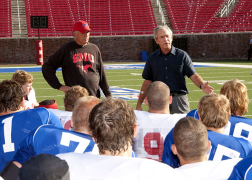 Former President George W. Bush visits an SMU football practice on August 24, 2009.