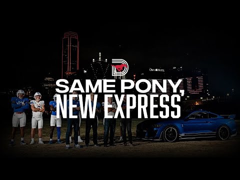 SMU football players posing in front of Dallas skyline