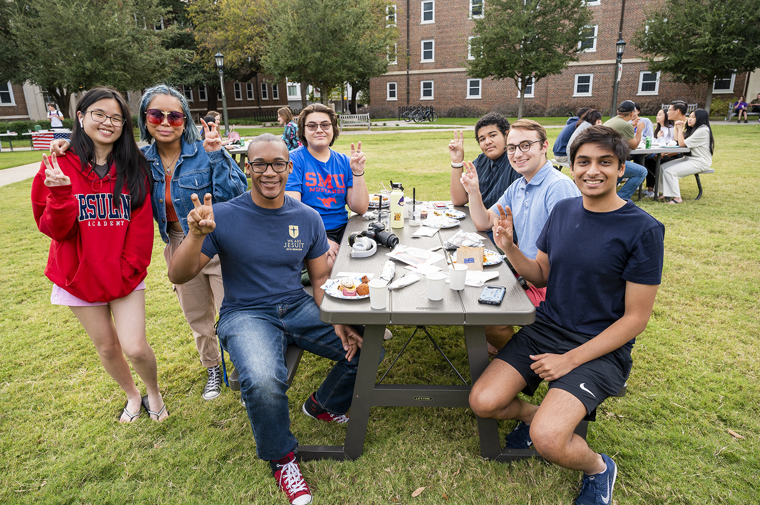 Group of people seated at a picnic table