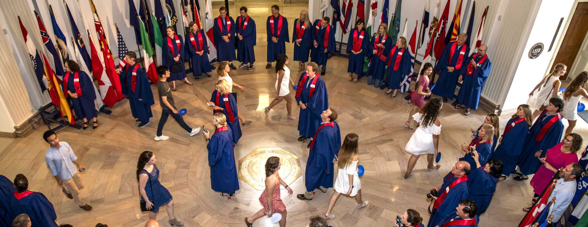 Incoming freshmen walk through Dallas Hall