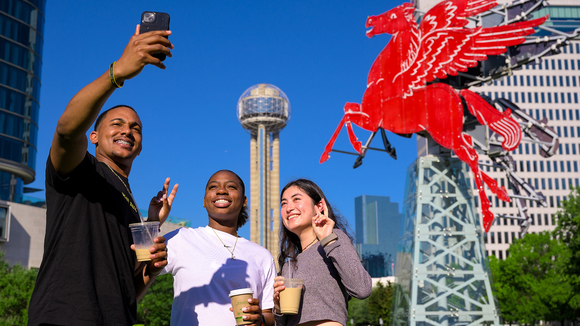 SMU students taking a selfie while visiting downtown Dallas.