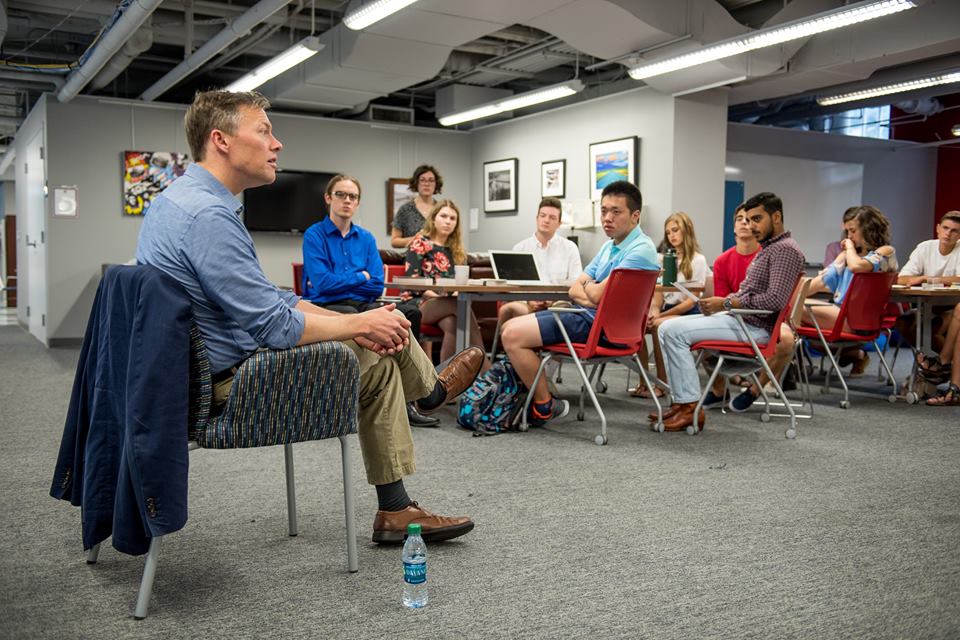 Evicted author Matthew Desmond speaks with a group of SMU students.
