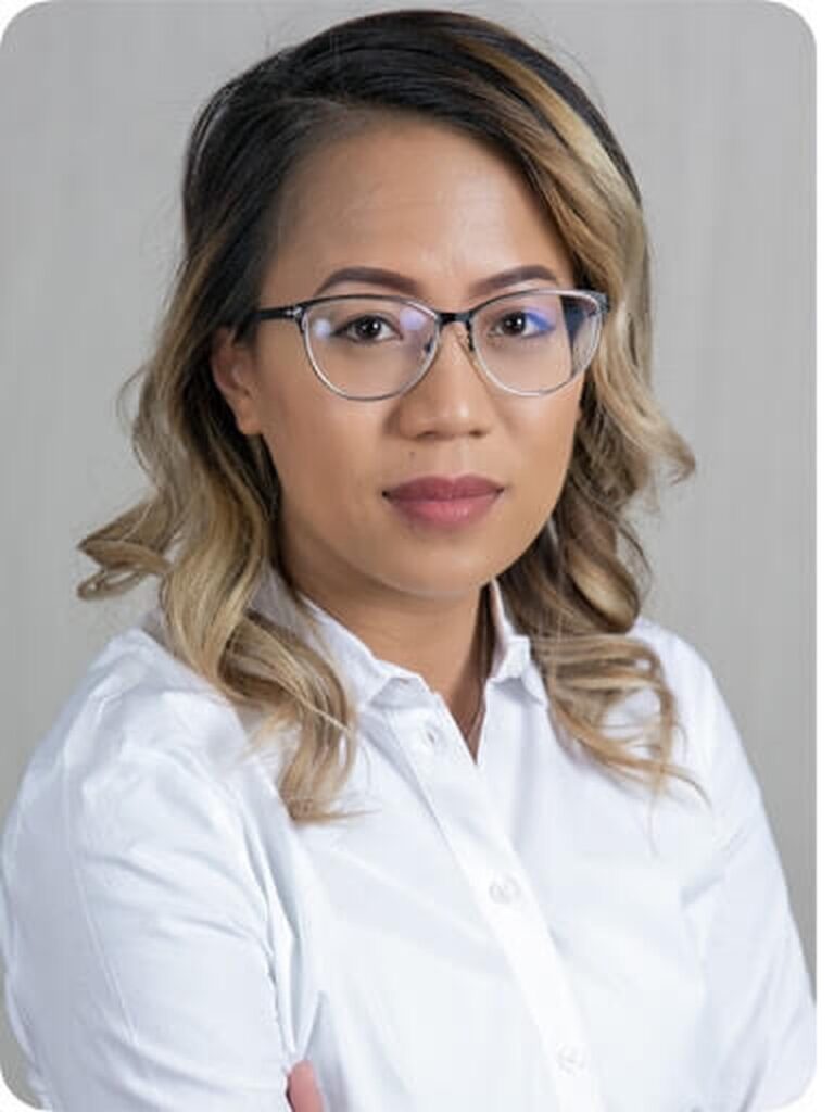 A professional headshot of Kim Bouthavong