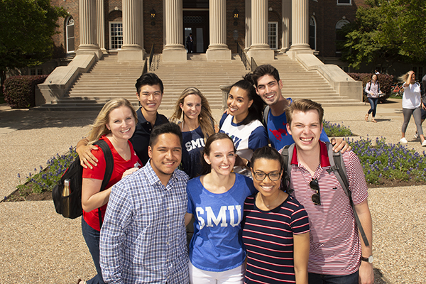 Group of Students standing in front of Dallas Hall.