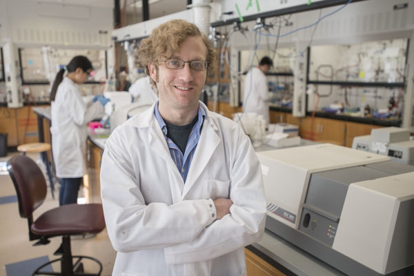 Doctor Alex Lippert in White Lab Coat.