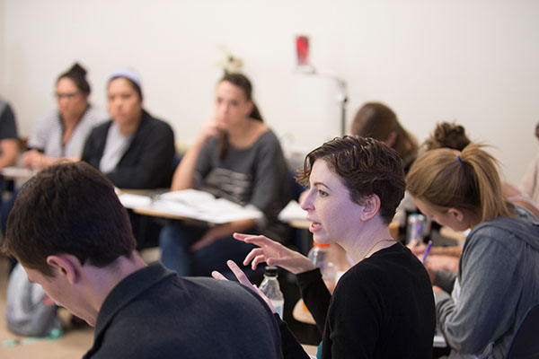 Erin Hochman in a classroom with students.