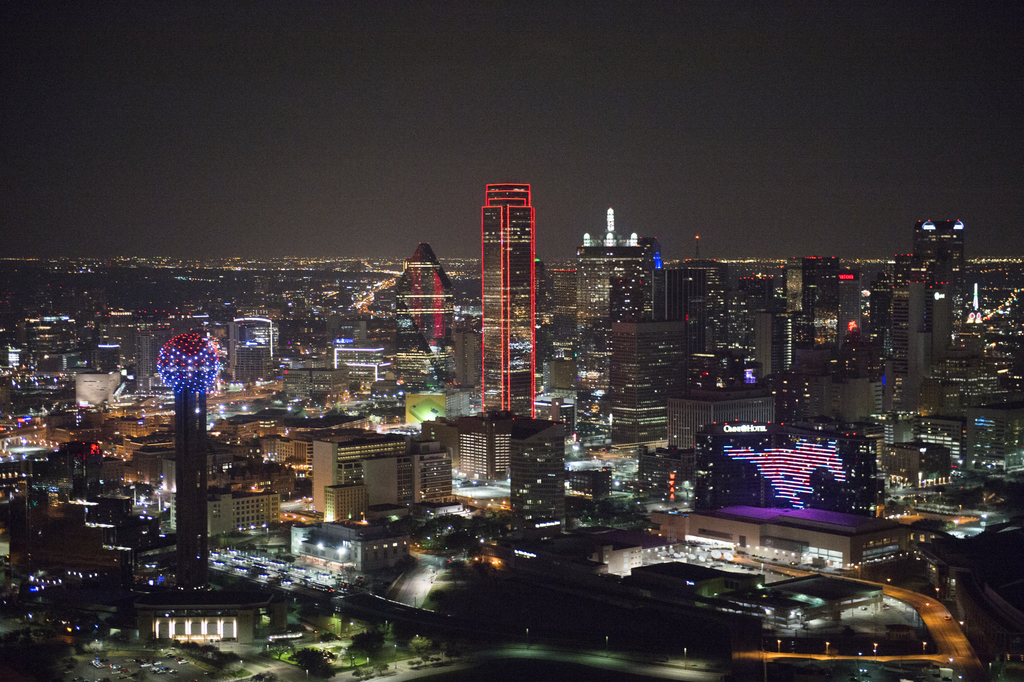 A photo of the downtown Dallas skyline at night.