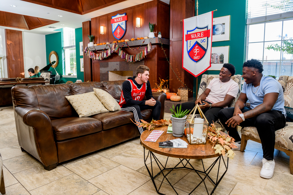 People lounging in one of the common areas of the student housing.