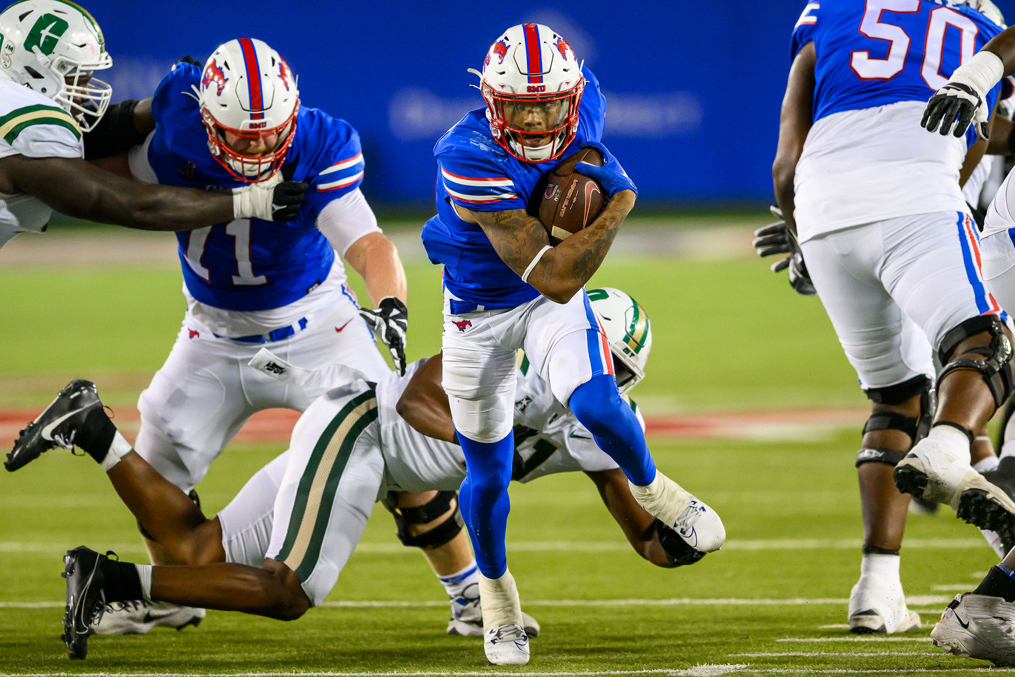  SMU football player running with the ball