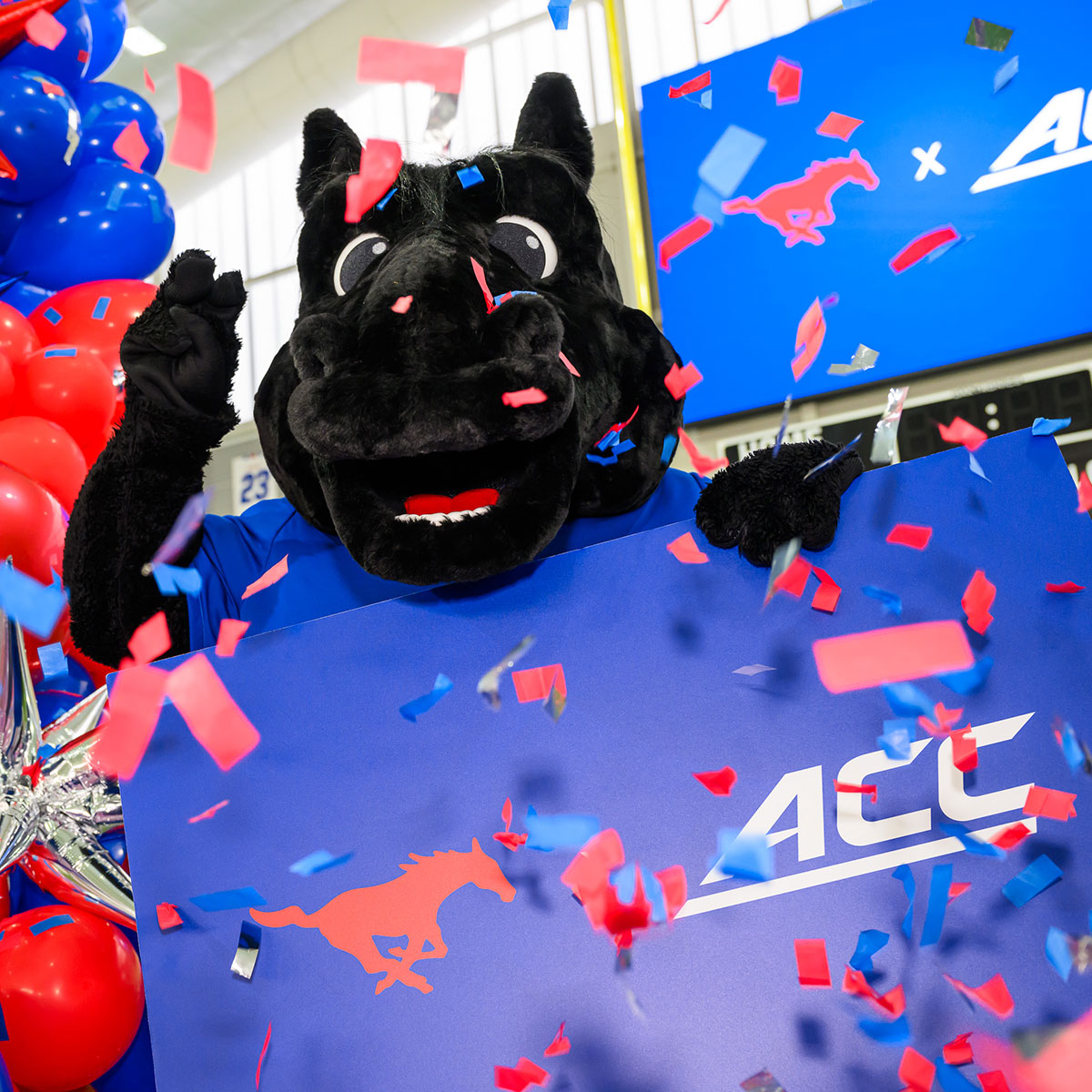 Costumed Peruna mascot holds sign with SMU and ACC logos