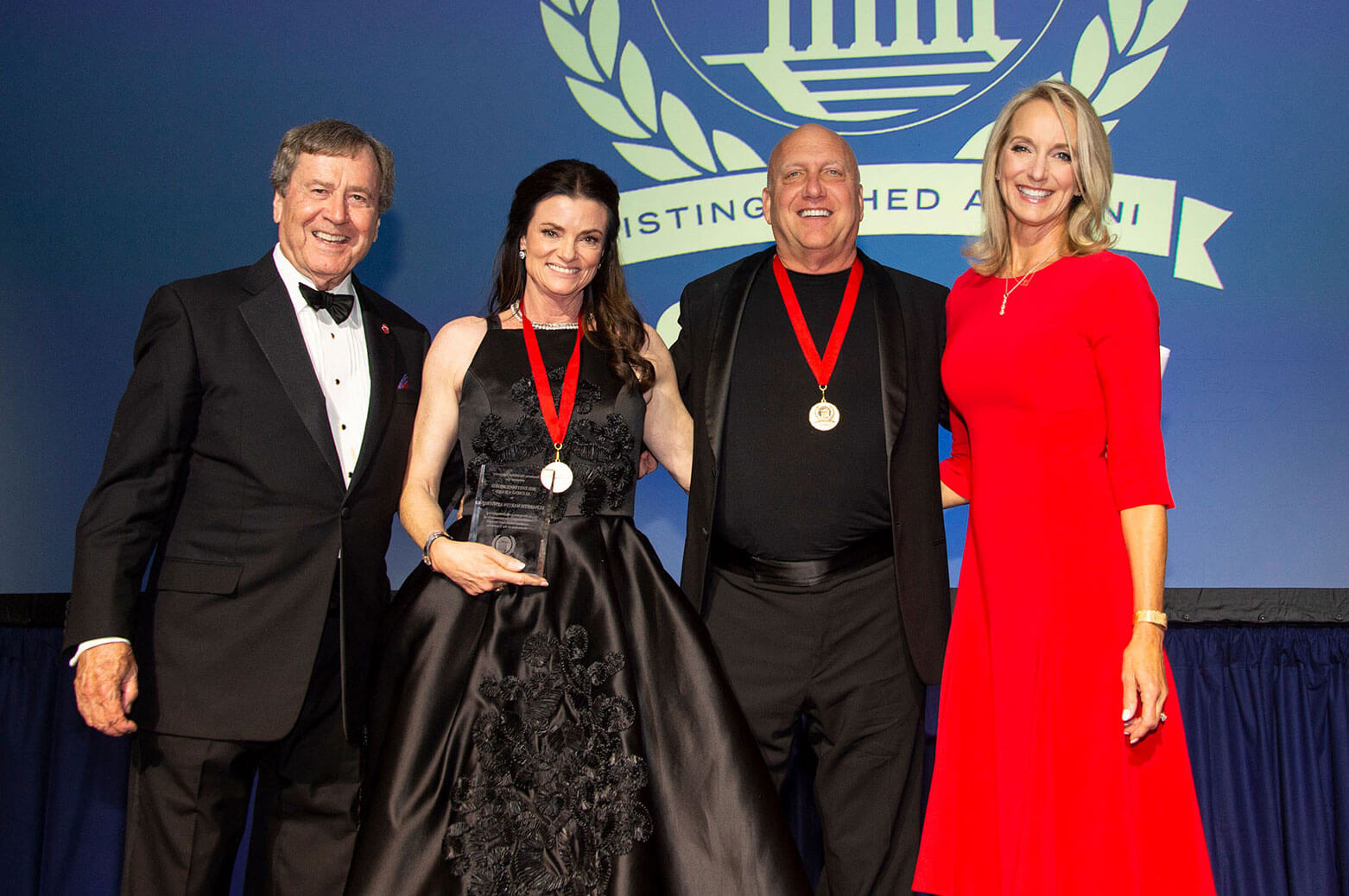 Kristin Henderson (right) with R. Gerald Turner, Liz Armstrong and Bill Armstrong at the Distinguished Alumni Awards