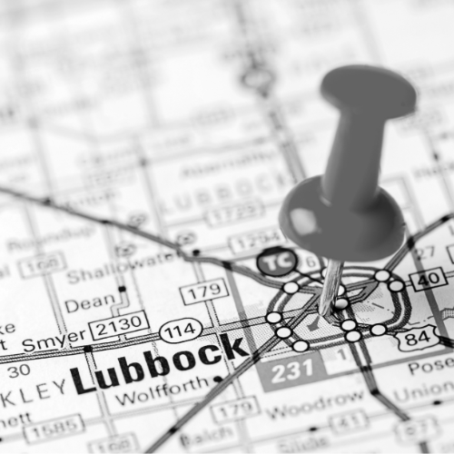 Black and white image of a map with a pin marking Lubbock.