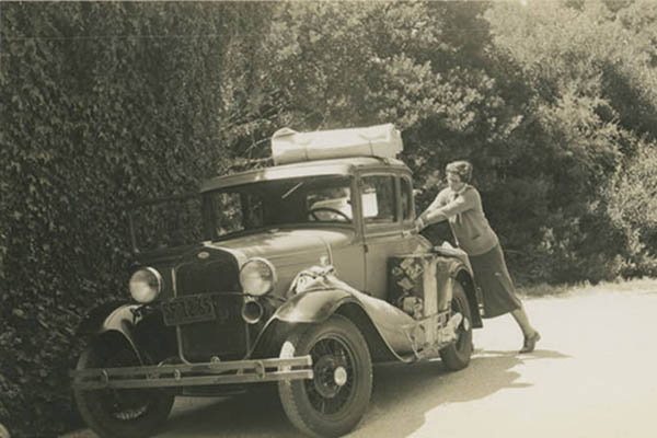 Woman packing car for trip