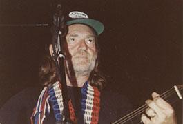 [Willie Nelson Wearing JCPenney Auto Center Hat]