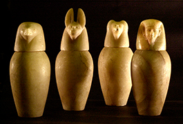 Set of 4 alabaster canopic jars with lids