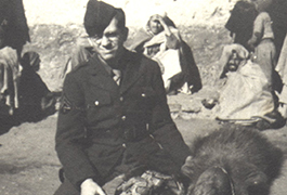 Melvin Shaffer and camel, on the Sahara, Algeria, 1943