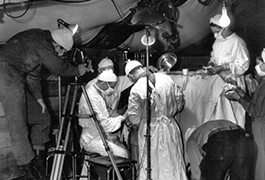 Melvin Shaffer filming in the OR, 8th Evacuation Hospital, Italy, 1944