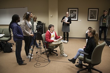 Students learn oral history filming techniques from the Norwick Center staff.