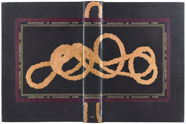 Decorative binding with inlaid design of a rope surrounded by a border with "Adventures of Huckleberry Finn" repeating.