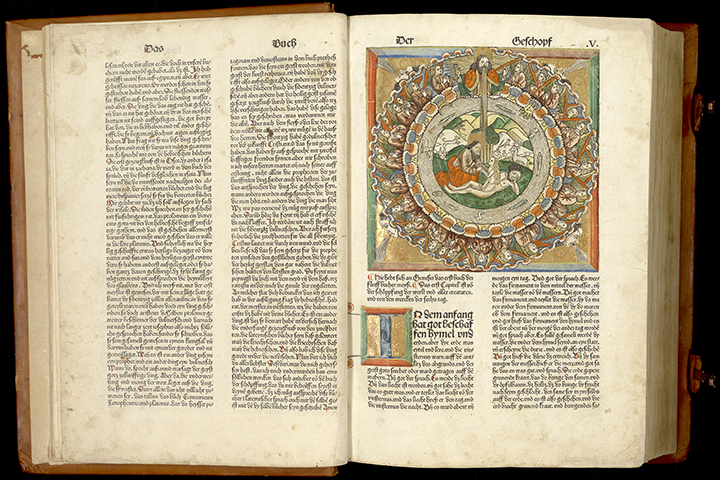An illustrated German Bible open to Genesis with a hand colored exhibited woodcut of God creating Eve from Adam’s rib encircled by other scenes from Genesis.