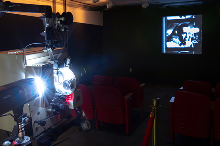 A film projector and image on the screen