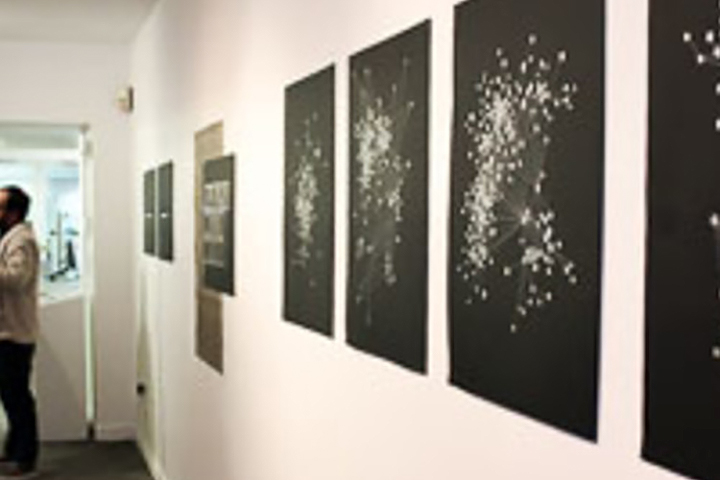 black and white artwork in a gallery setting