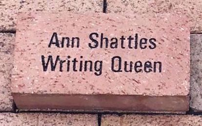 Brick with 2 lines of text reading Ann Shattles Writing Queen